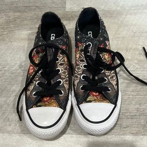 Gently used colorful pair of discontinued low top converse sneakers.